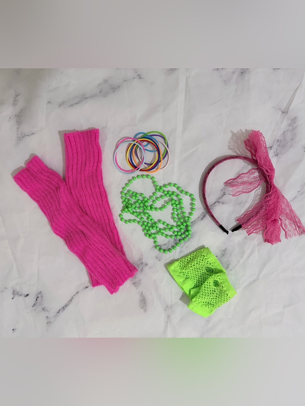 Kids 80’s costume with leg warmers, bracelets, a beaded necklace, and more
